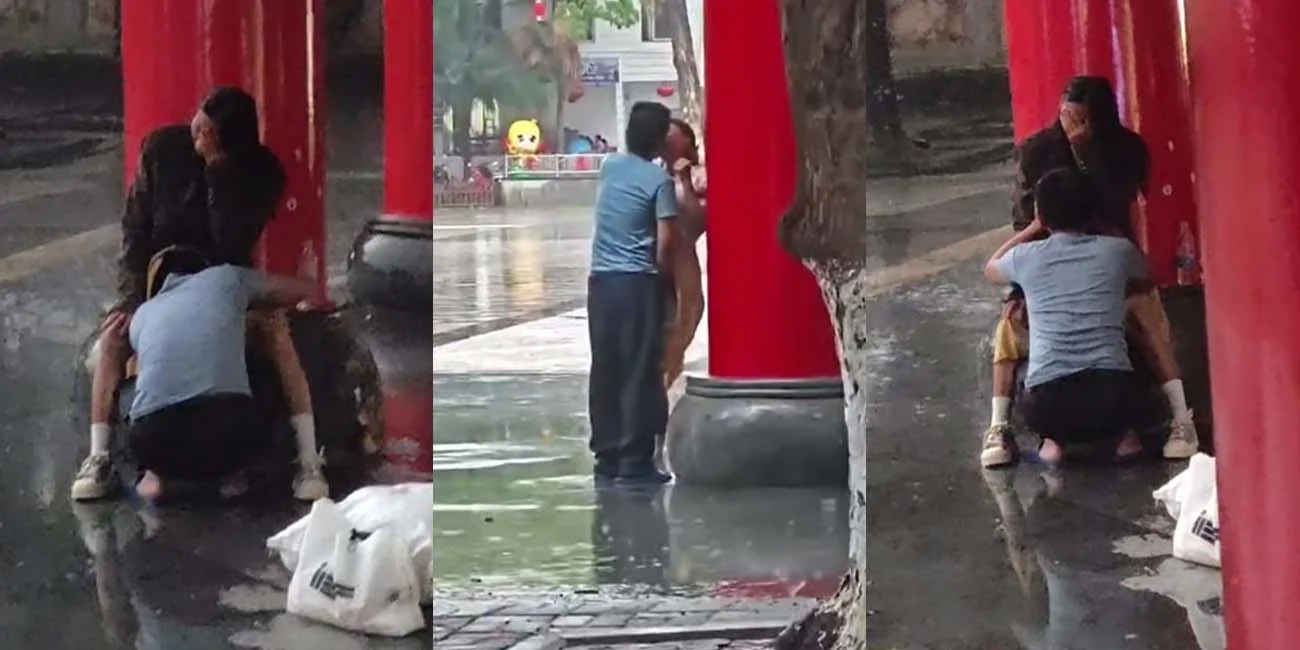 海南五指山三月三广场 雨中激吻情众互舔 最后被帽子叔叔们带走 这俩人也太饥渴了吧
